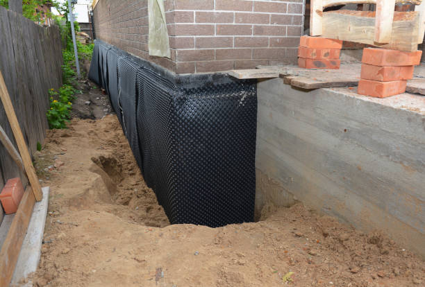 Happy homeowners after waterproofing job in Somerset Center